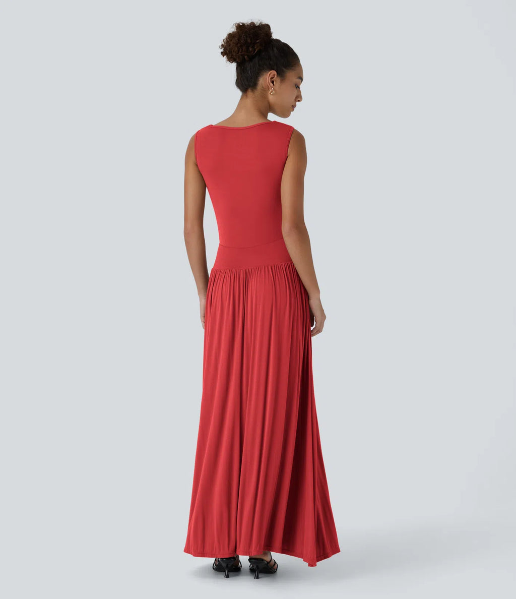 Vestido maxi fluido canalé, escote barco, tirante asimétrico, fruncido lateral, bolsillos